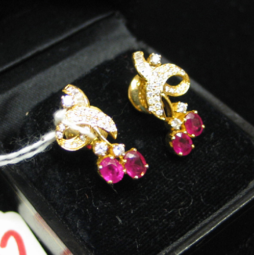 Appraisal: PAIR OF RUBY DIAMOND AND FOURTEEN KARAT GOLD EARRINGS each