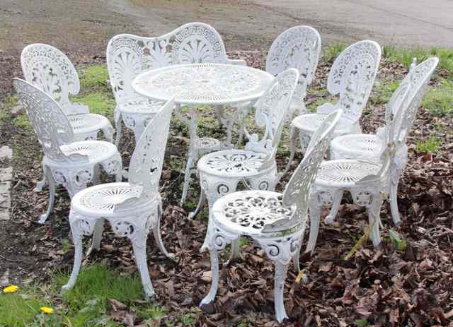 Appraisal: A suite of white painted garden furniture of nine chairs