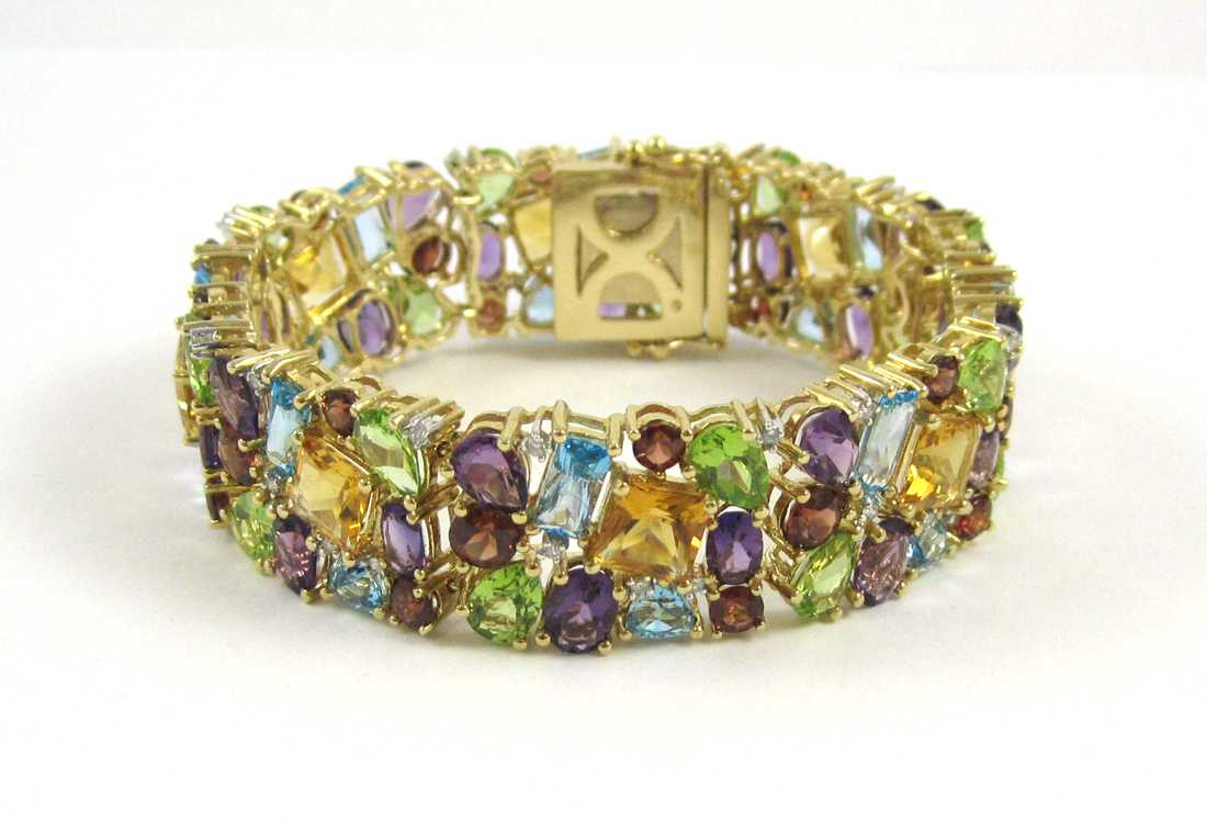 Appraisal: MULTI COLORED GEMSTONE AND DIAMOND BRACELET The k yellow gold