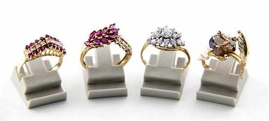 Appraisal: Gold and gemstone rings two with rubies and diamonds one