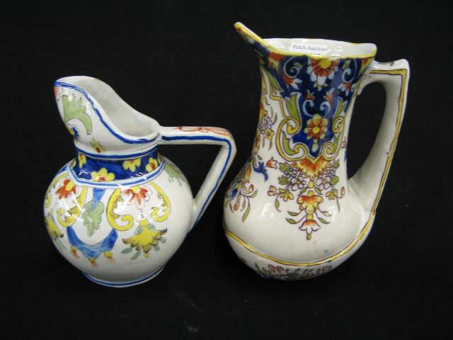 Appraisal: Two French Faience Pottery Pitchers fine florals signed tallest has