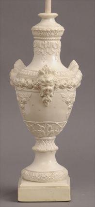 Appraisal: NEOCLASSICAL-STYLE IVORY-GLAZED PLASTER VASE MOUNTED AS A LAMP The urn-shaped