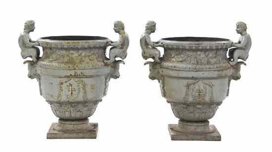 Appraisal: A Pair of Victorian Cast Iron Urns each with double