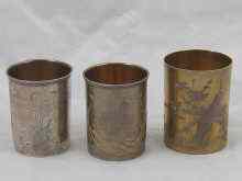 Appraisal: Three Russian silver beakers with traditional engraved decoration tallest approx