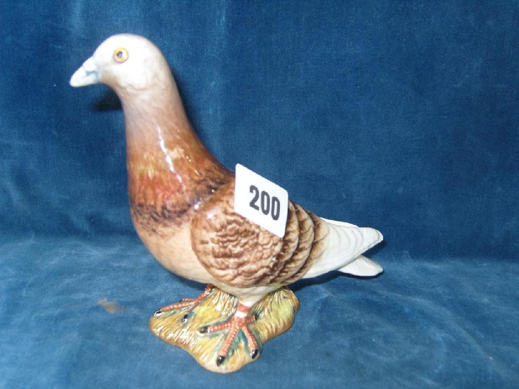 Appraisal: A Beswick model of a racing pigeon with brown and