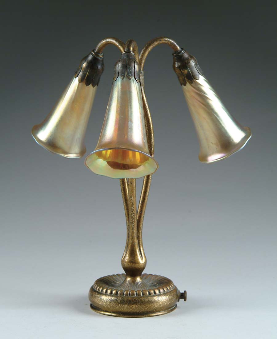 Appraisal: THREE LIGHT LILY Wonderful gold dore Tiffany three light base