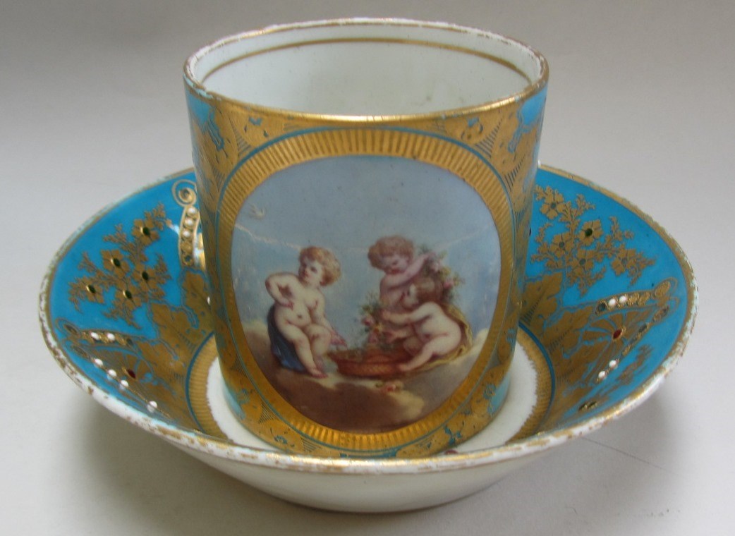 Appraisal: A Sevres style turquoise ground jewelled' cup and saucer late