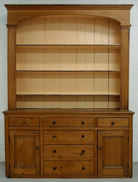 Appraisal: Pine open two-part Dutch cupboard th c with molded cornice