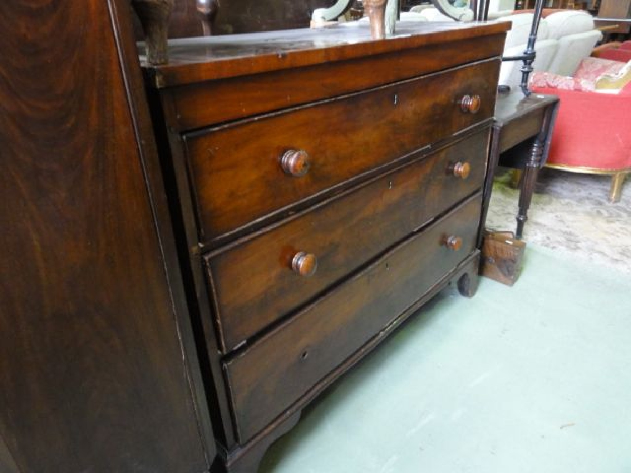 Appraisal: A th century mahogany bedroom chest of three long graduated