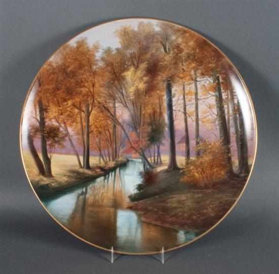 Appraisal: KPM Berlin painted porcelain charger early th century autumnal landscape