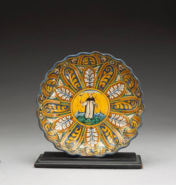 Appraisal: An Italian maiolica polychrome decorated crespina Faenza circa Centering a