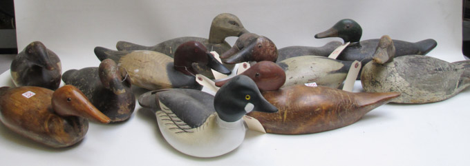 Appraisal: ELEVEN HAND CARVED WOOD DUCK DECOYS including Ducks Unlimited -