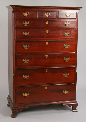 Appraisal: Three small drawers over graduated drawers all thumb-molded brass bail