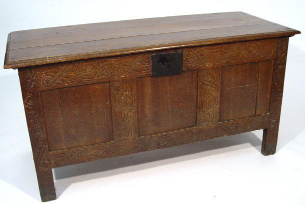 Appraisal: th Century oak three panelled coffer with carved decoration to