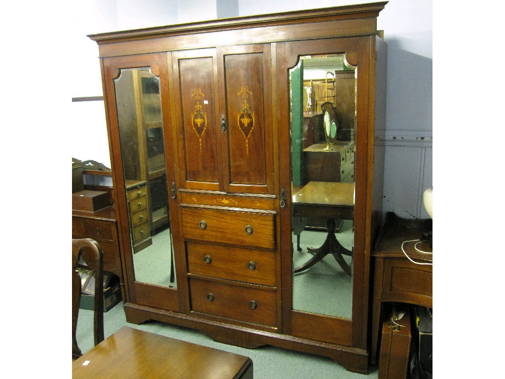 Appraisal: Edwardian mahogany bedroom suite comprising triple wardrobe dressing table and