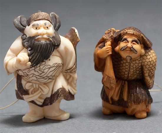 Appraisal: Two Japanese carved ivory netsukes Chinese warrior and man carrying