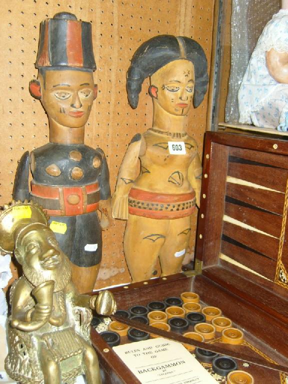 Appraisal: A pair of carved and painted ethnic characters of male