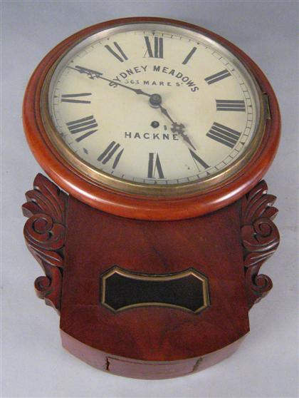 Appraisal: Carved walnut wall clock The circular diam with stamped 'SYDNEY