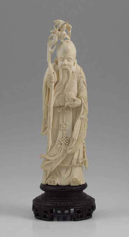 Appraisal: CHINESE CARVED IVORY IMMORTAL FIGURE Carved ivory figure of Li