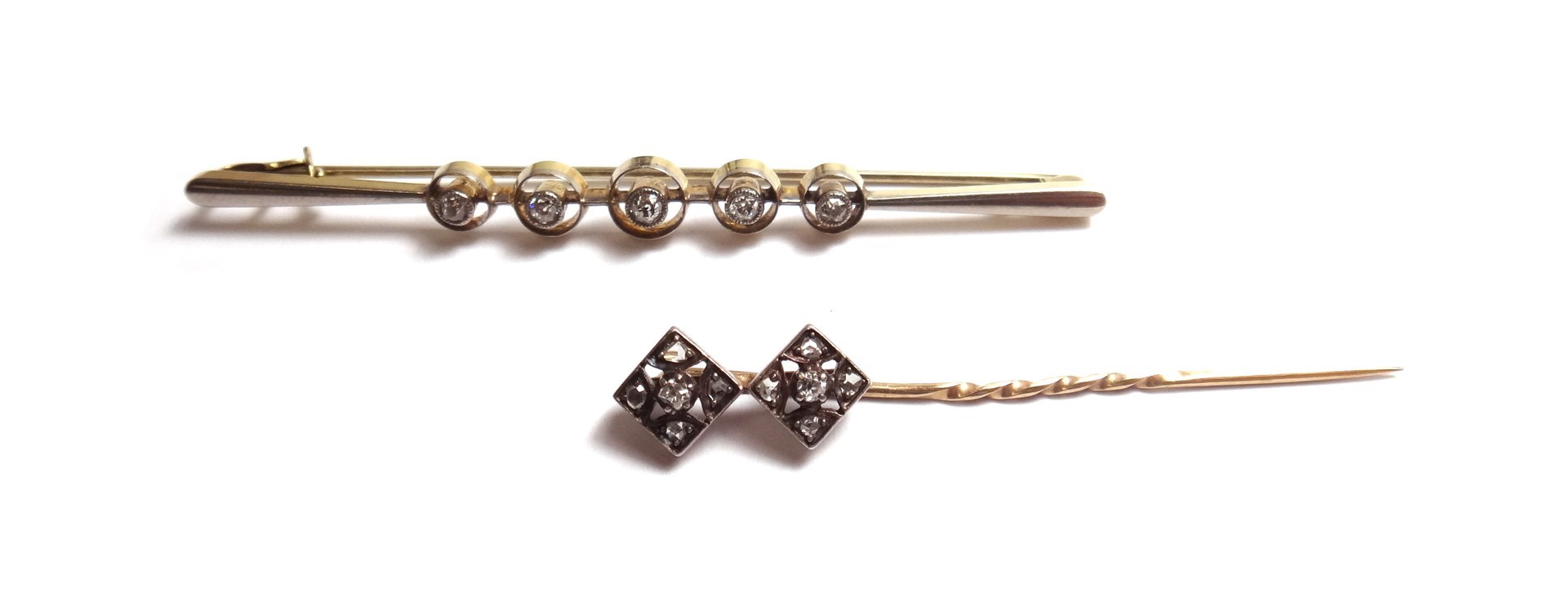 Appraisal: A gold and diamond set five stone bar brooch collet