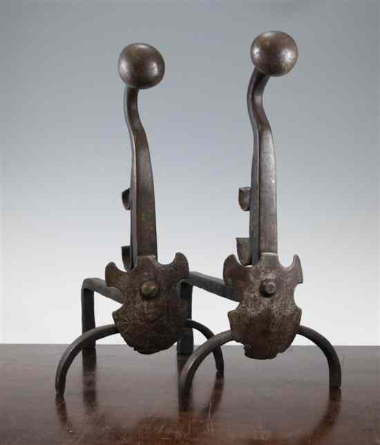 Appraisal: A pair of th century wrought iron dogs in Estimate