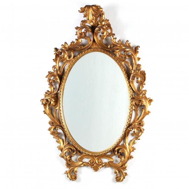 Appraisal: HIGH RELIEF ROCOCO STYLE CARVED AND GILT FLORENTINE MIRROR First