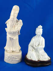 Appraisal: Two blanc de chine ceramic figures one seated holding a