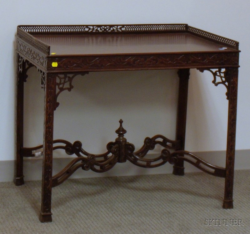 Appraisal: Georgian-style Carved Mahogany Tea Table repairs damage