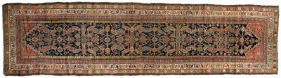 Appraisal: Persian runner repeating designs on a blue black field with