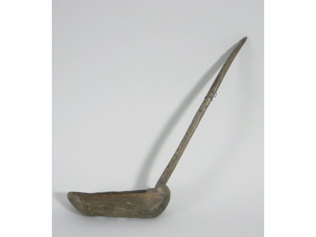 Appraisal: A primitive Welsh treen scratch carved Straining Ladle