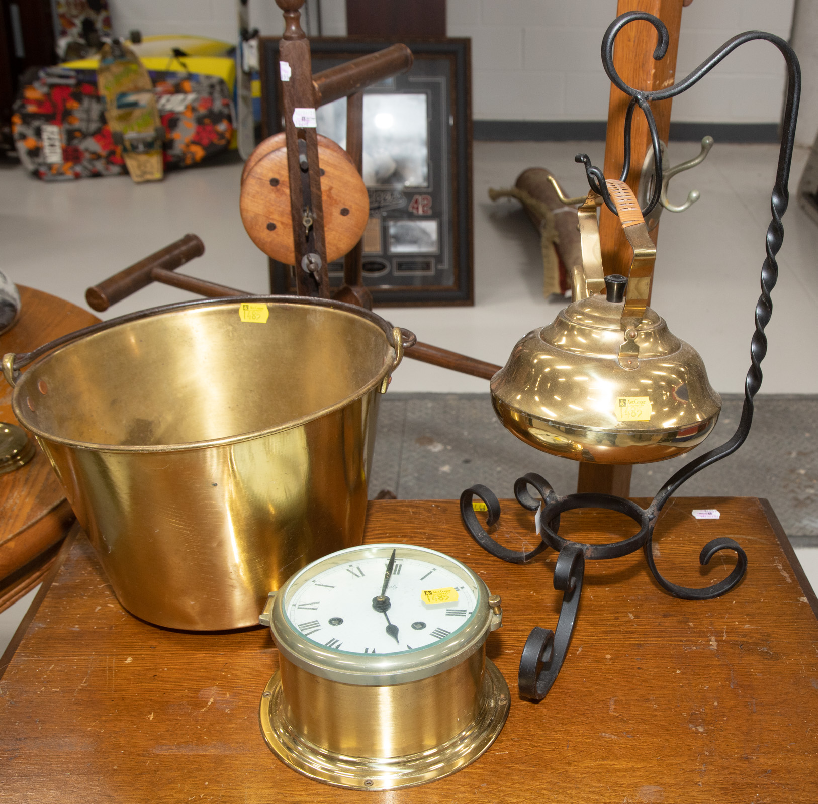 Appraisal: THREE COLLECTIBLE BRASS ITEMS Includes brass tea kettle on wrought