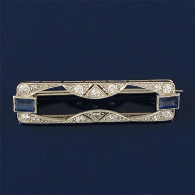 Appraisal: A small art deco diamond and sapphire bar brooch cm