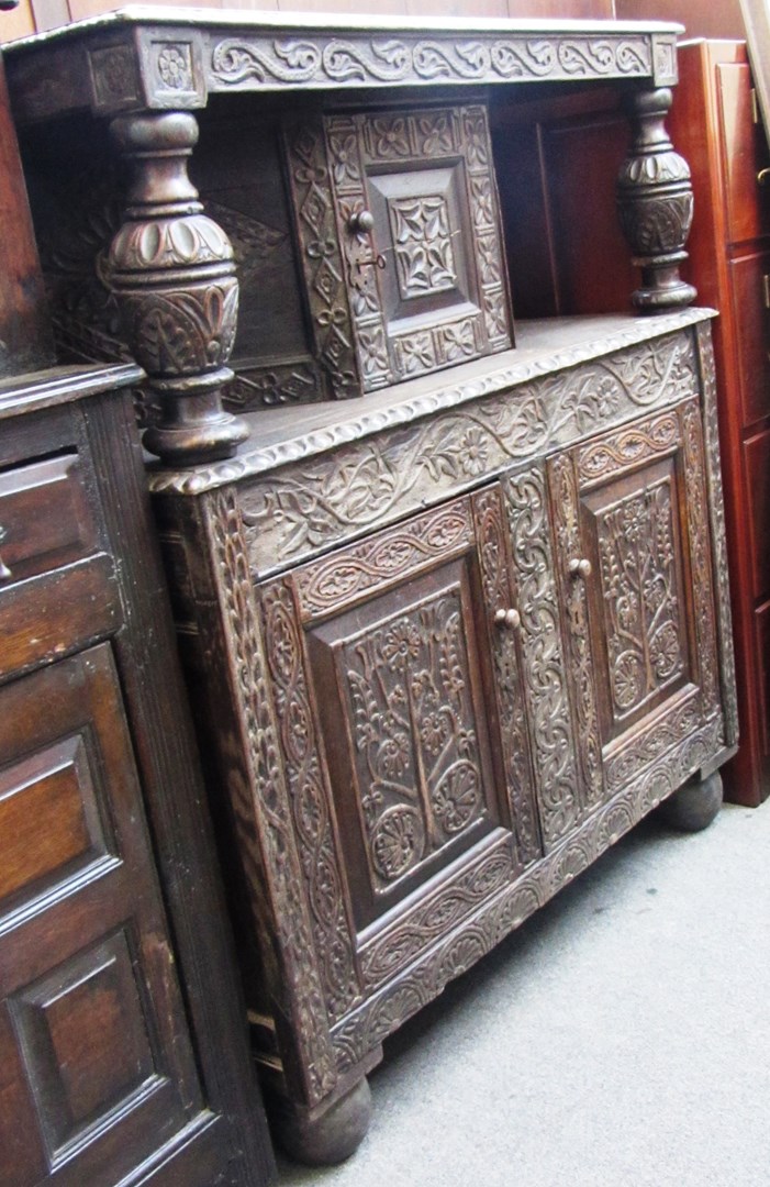 Appraisal: A th century carved oak court cupboard of th century