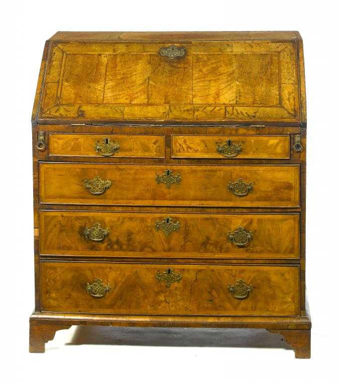 Appraisal: A GEORGE II WALNUT AND FEATHERBANDED BUREAU the flap and