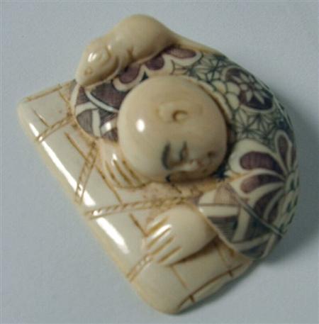 Appraisal: A Japanese ivory netsuke Meiji period depicting a sleeping boy