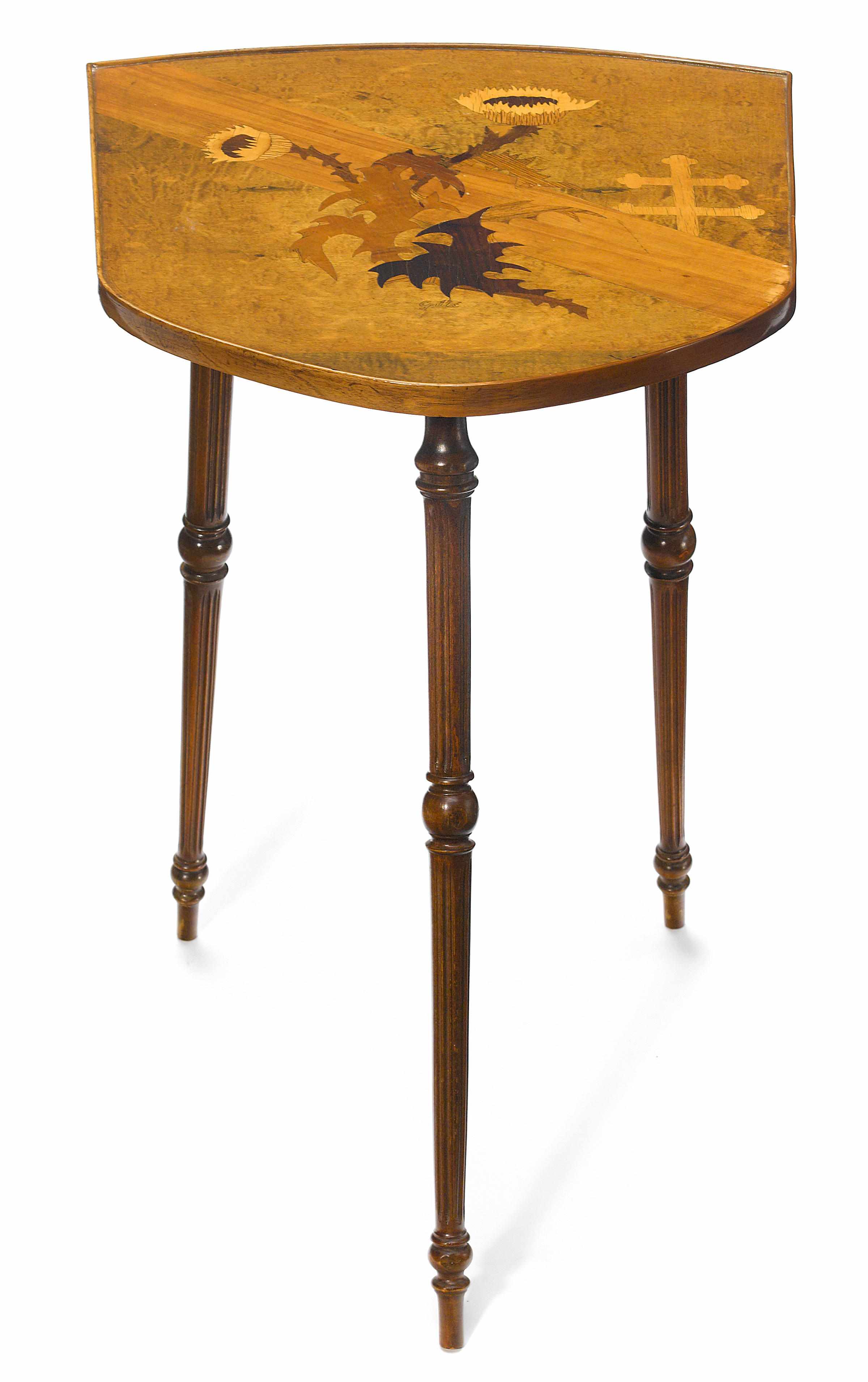 Appraisal: A Gall marquetry and turned walnut shield shaped occasional table