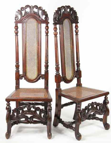 Appraisal: Pair of Jacobean Revival Hall Chairscirca English oak tall back