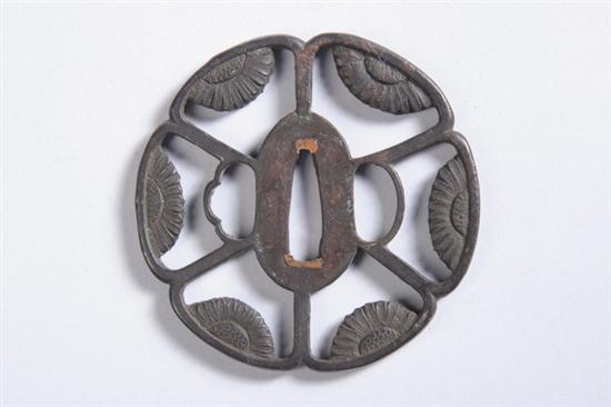 Appraisal: JAPANESE IRON TSUBA th century Chrysanthemum form sukashi with half