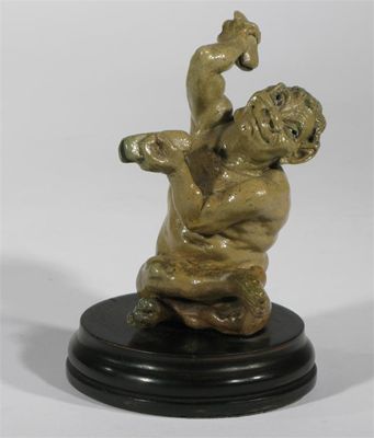 Appraisal: A Martin Brothers stoneware Imp Musician figure by Robert Wallace