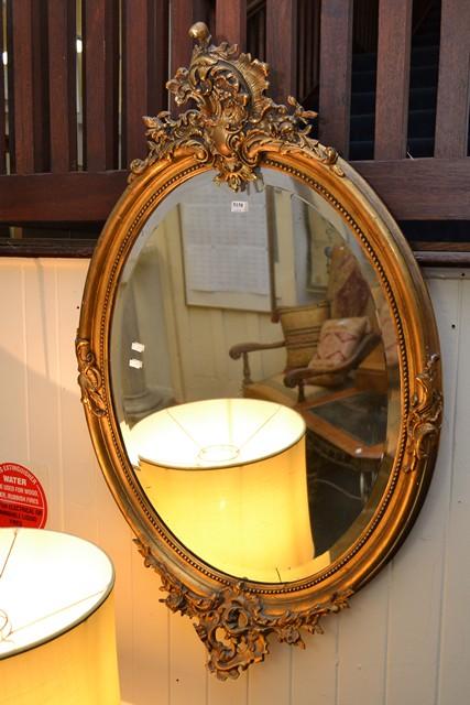 Appraisal: GILTWOOD FRAMED OVAL BEVEL WALL MIRROR GILTWOOD FRAMED OVAL BEVEL