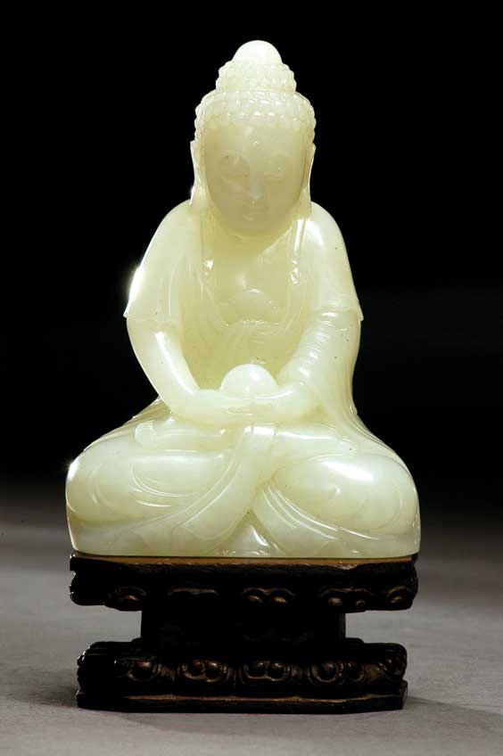 Appraisal: CARVED WHITE JADE BUDDHA Well carved Chinese white jade model