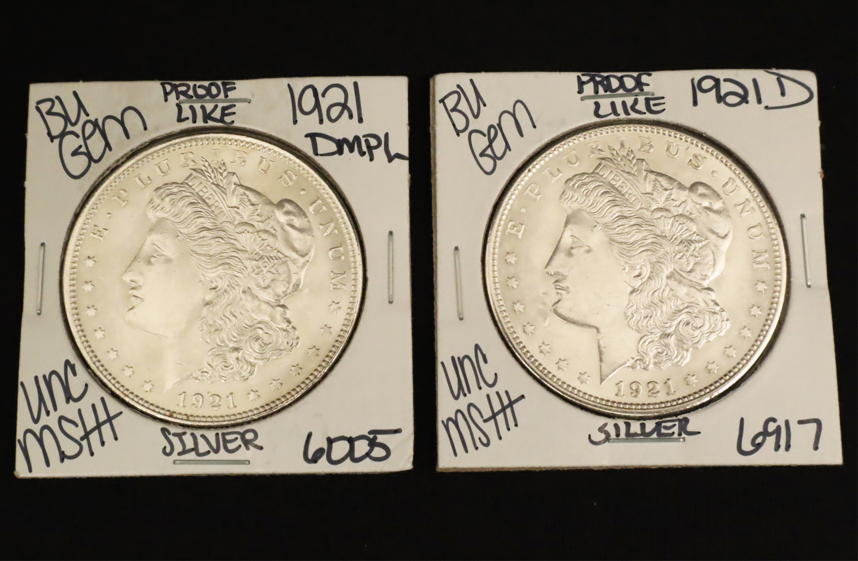 Appraisal: TWO BU MORGAN SILVER DOLLARS Two BU Morgan Silver Dollars