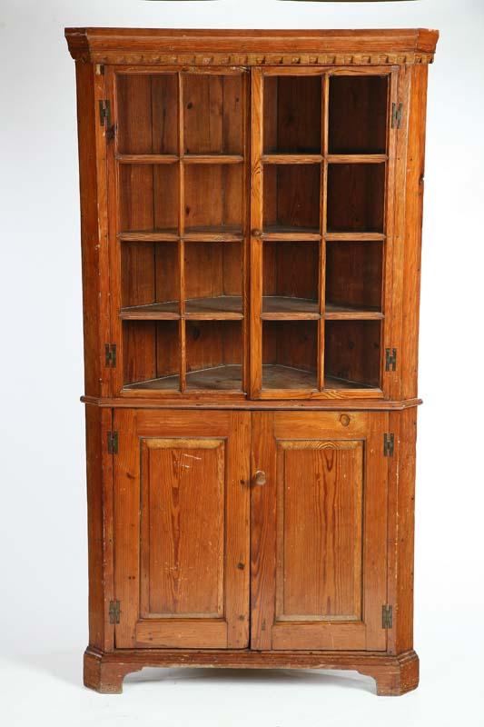 Appraisal: CORNER CUPBOARD Southern pine with a dentil carved cornice over