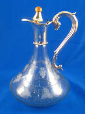 Appraisal: A silver plate mounted claret jug with star cut base