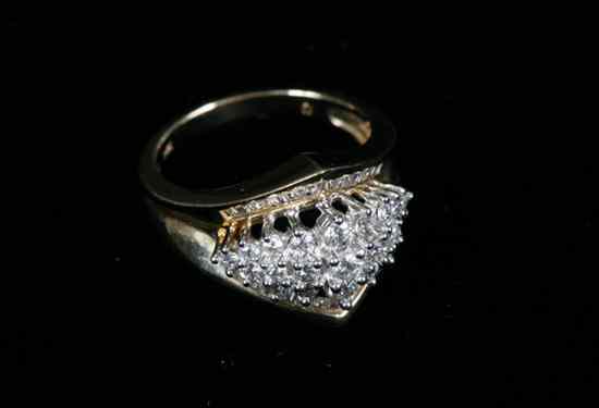 Appraisal: K YELLOW GOLD AND DIMAOND CHEVRON-SHAPE DOME RING Tiered arrangement