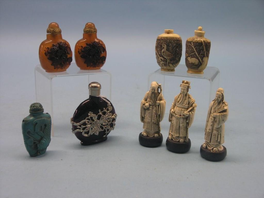 Appraisal: A pair of Chinese carved snuff bottles and four other