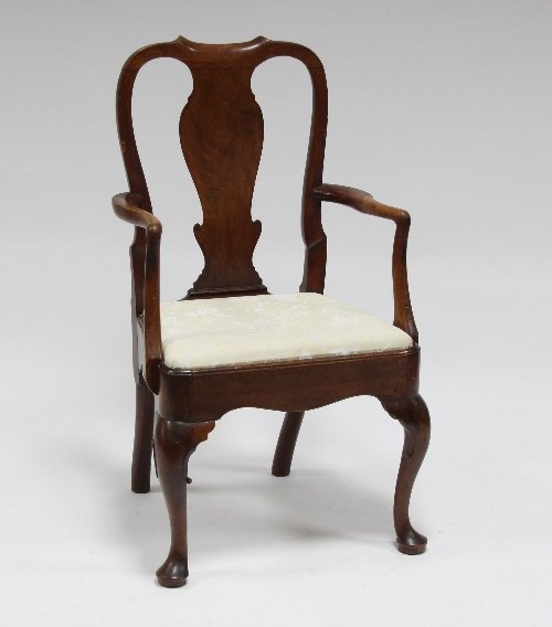 Appraisal: A George II walnut armchair with vase shaped splat drop-in