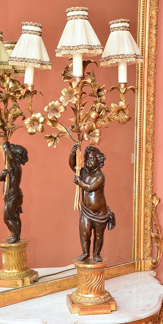 Appraisal: A FRENCH BRONZE AND GILT METAL CANDELABRA now fitted for