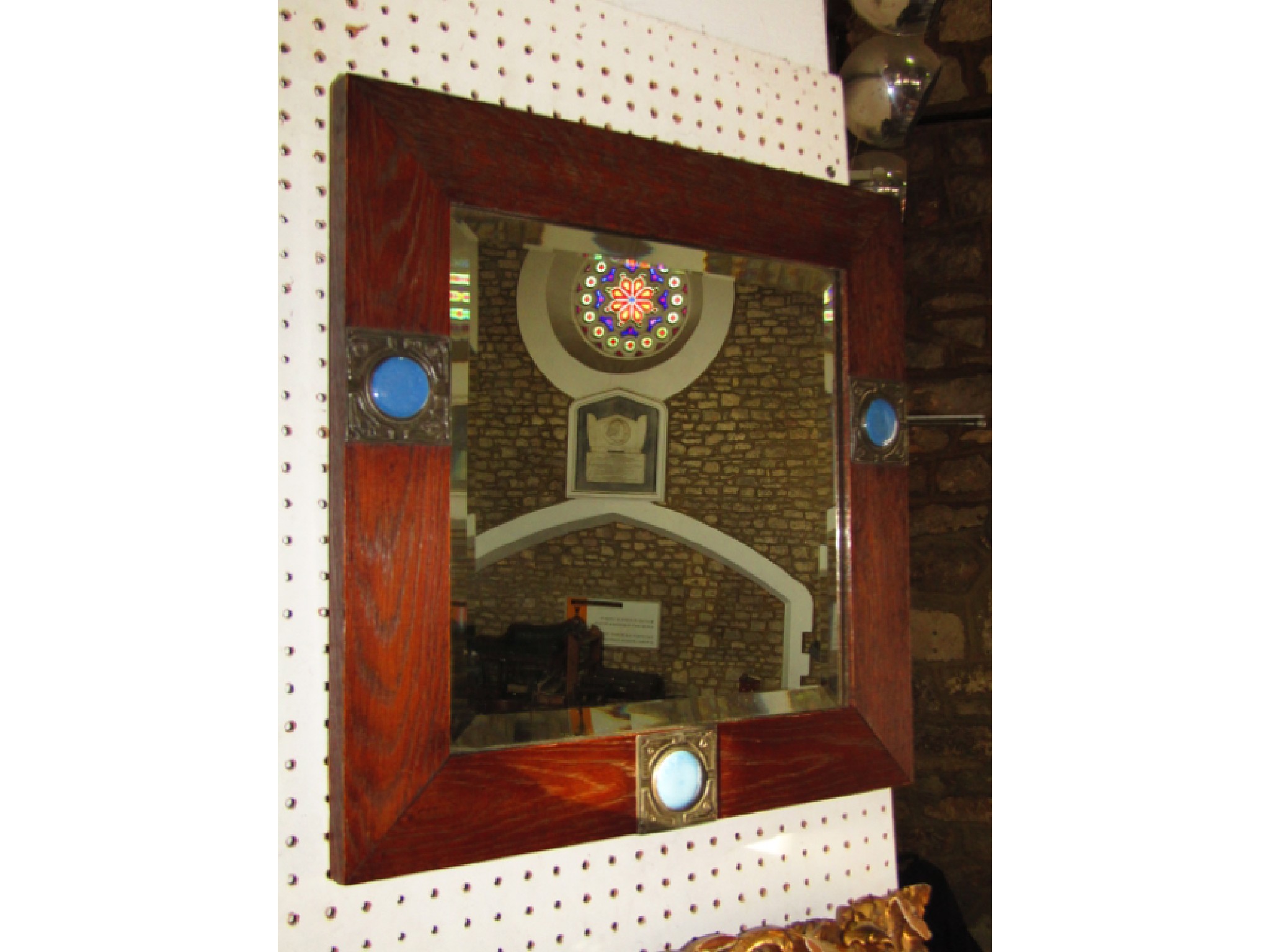 Appraisal: An oak framed wall mirror of squared form in the