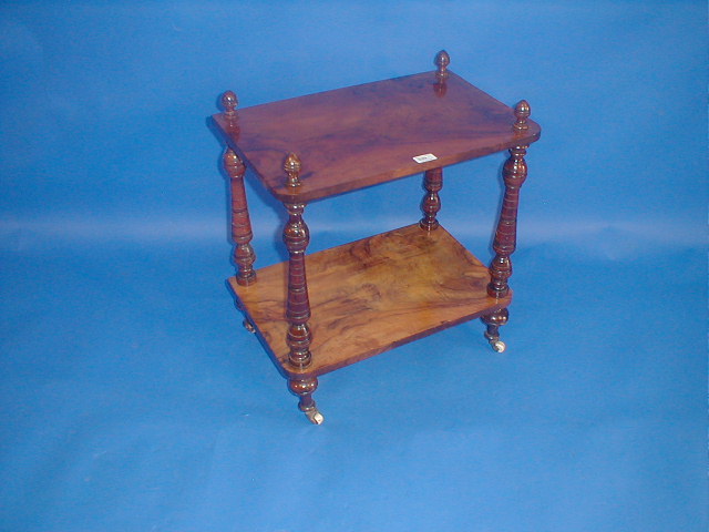 Appraisal: A Victorian figured walnut two-tier whatnot